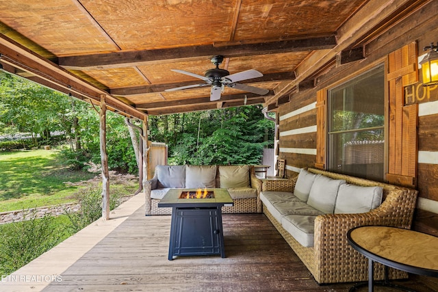 wooden terrace featuring an outdoor living space with a fire pit and ceiling fan