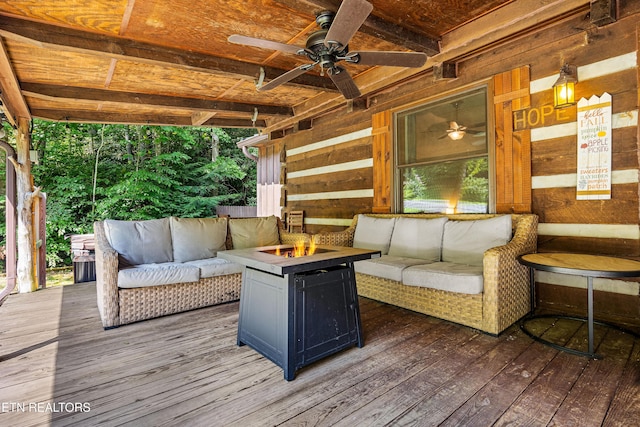 deck featuring an outdoor living space with a fire pit and ceiling fan