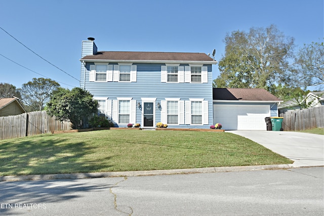 colonial house featuring a garage, a front yard, fence, and a chimney