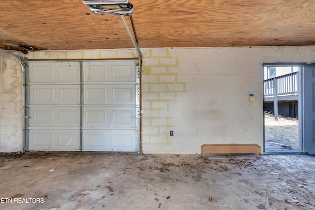 garage with concrete block wall