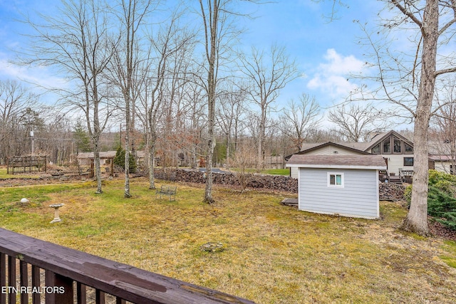 view of yard with an outdoor structure and a shed