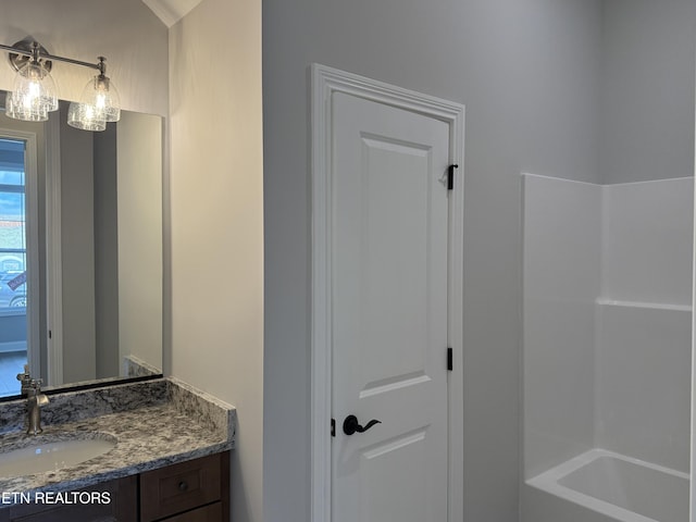 bathroom with shower / tub combination and vanity