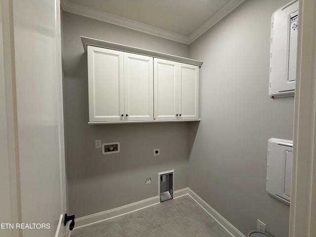 laundry area with cabinet space, gas dryer hookup, crown molding, hookup for an electric dryer, and washer hookup