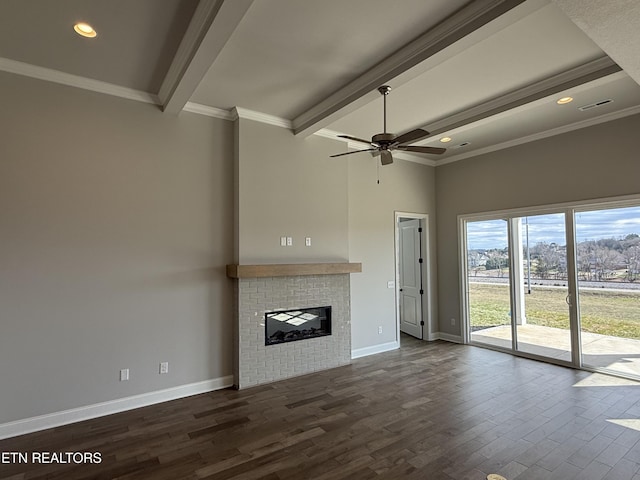 unfurnished living room featuring baseboards, visible vents, dark wood-style flooring, beamed ceiling, and a brick fireplace