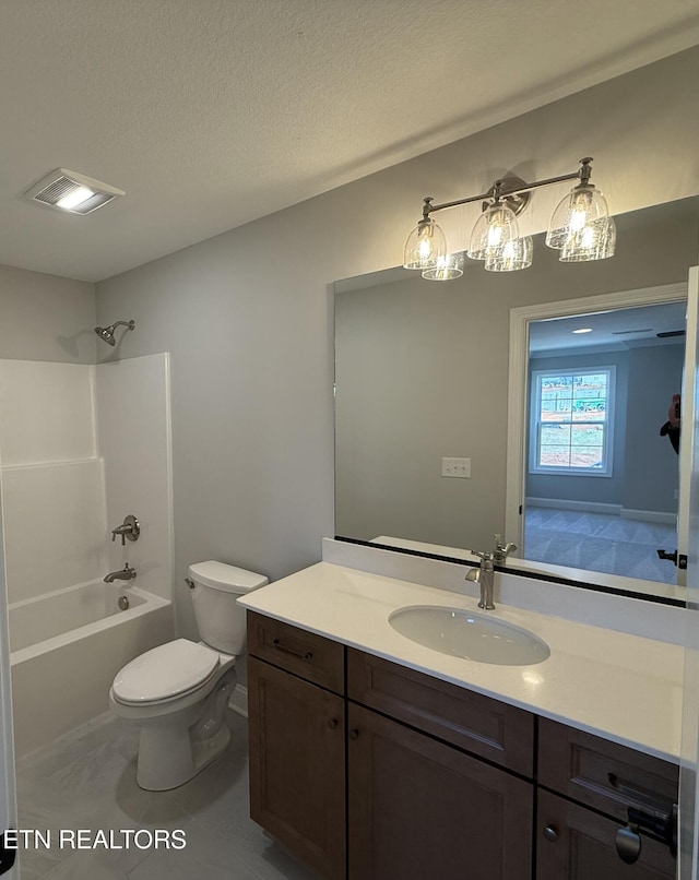 bathroom featuring visible vents, shower / bathing tub combination, toilet, vanity, and a textured ceiling