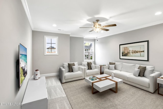 carpeted living area with recessed lighting, a ceiling fan, crown molding, and baseboards