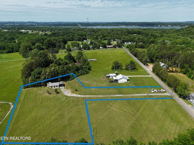 aerial view of property and surrounding area with property parcel outlined