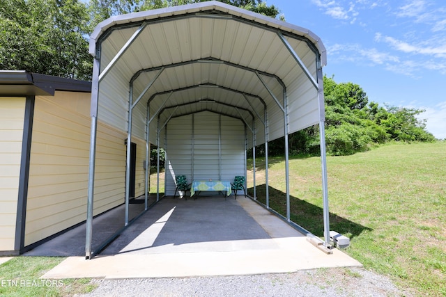 view of car parking featuring a detached carport and driveway