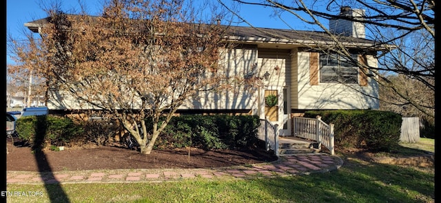 view of front of house with a chimney