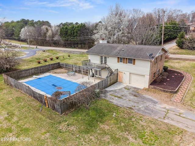 view of swimming pool with a yard, a fenced backyard, and a patio area