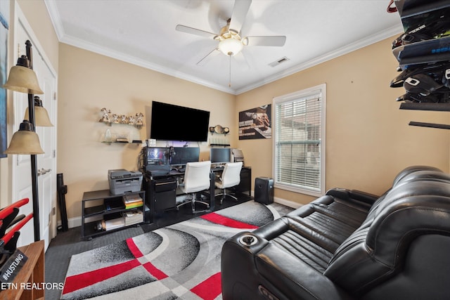 office space featuring ceiling fan, baseboards, visible vents, and crown molding