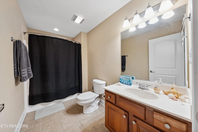 bathroom with tile patterned flooring, vanity, toilet, and baseboards