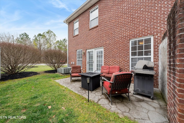 exterior space with central AC unit, an outdoor fire pit, and grilling area