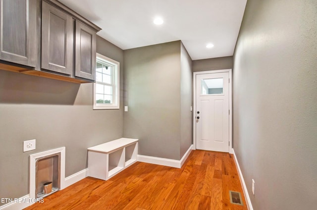 entryway with recessed lighting, light wood-type flooring, visible vents, and baseboards