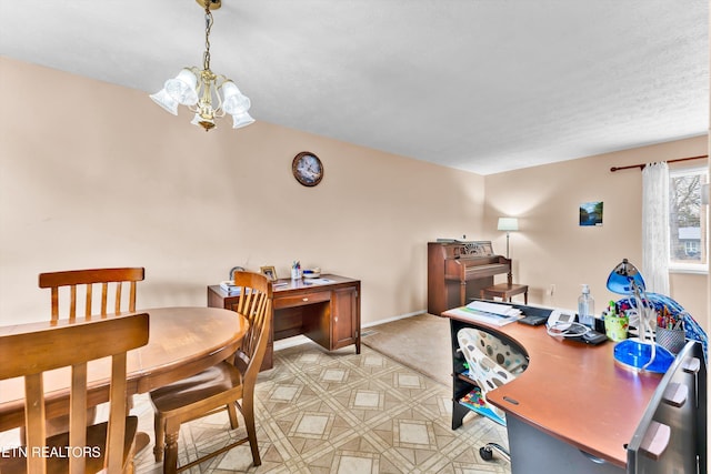 interior space featuring a notable chandelier and baseboards