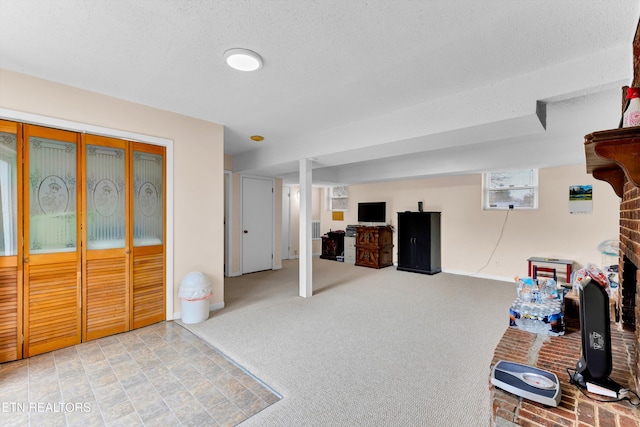 interior space with carpet, baseboards, and a textured ceiling