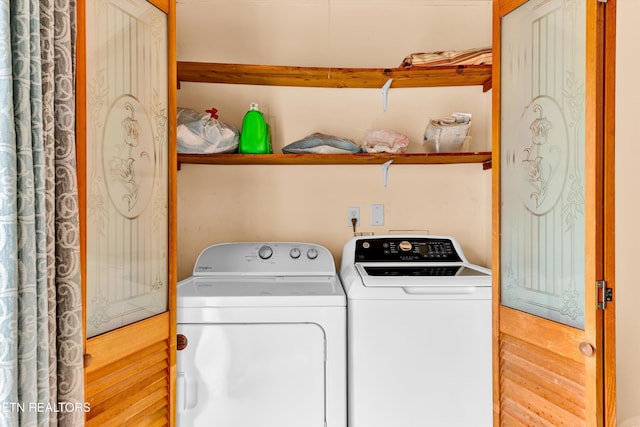 clothes washing area with laundry area and washing machine and clothes dryer