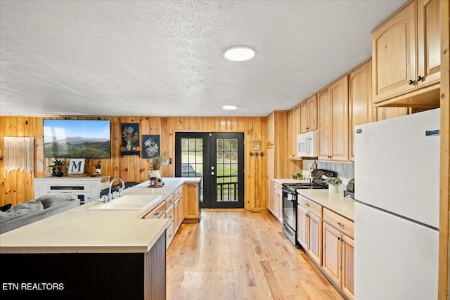 kitchen featuring light brown cabinets, white appliances, a sink, light countertops, and french doors