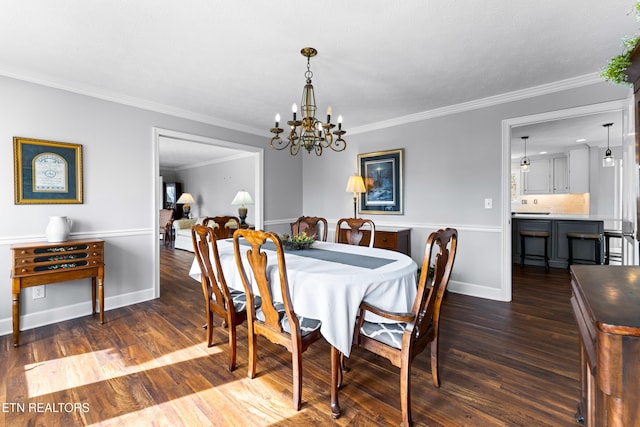 dining space featuring baseboards, dark wood-type flooring, and crown molding