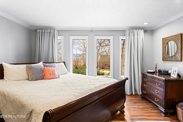 bedroom featuring recessed lighting, dark wood-style flooring, and ornamental molding