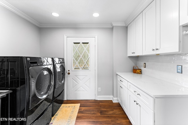 clothes washing area with crown molding, washer and clothes dryer, dark wood finished floors, recessed lighting, and cabinet space