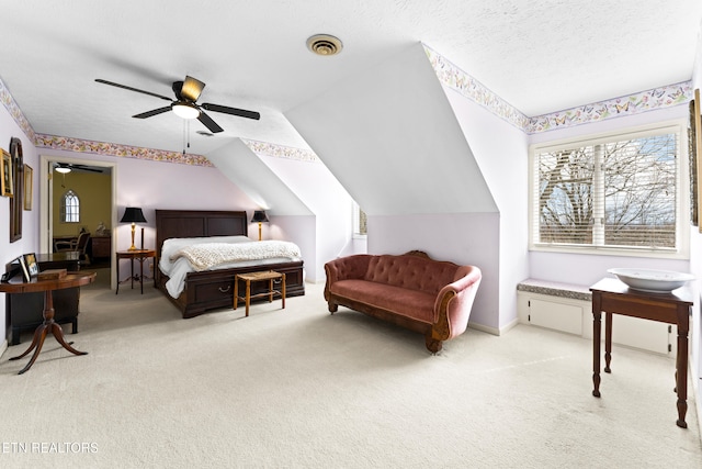 carpeted bedroom featuring baseboards, visible vents, lofted ceiling, ceiling fan, and a textured ceiling