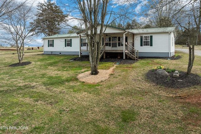 manufactured / mobile home with crawl space, a front lawn, and stairway