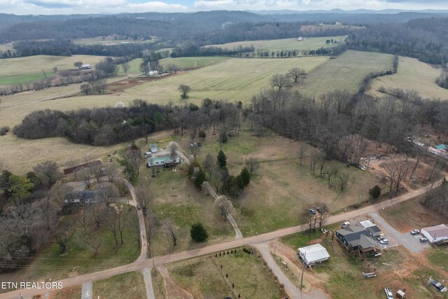 birds eye view of property featuring a rural view