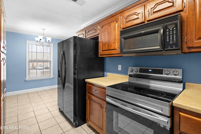 kitchen featuring baseboards, black appliances, light countertops, and crown molding