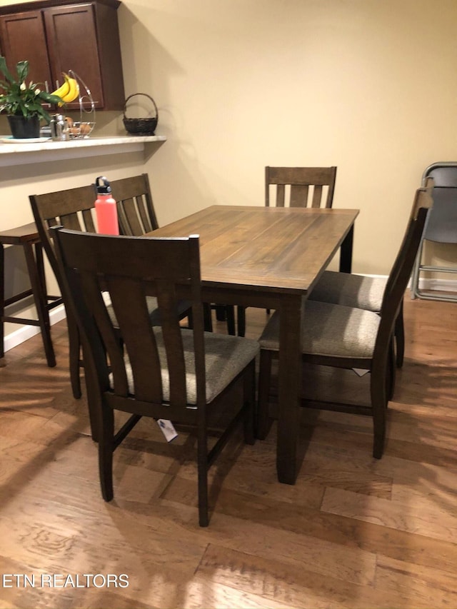 dining room with light wood-type flooring