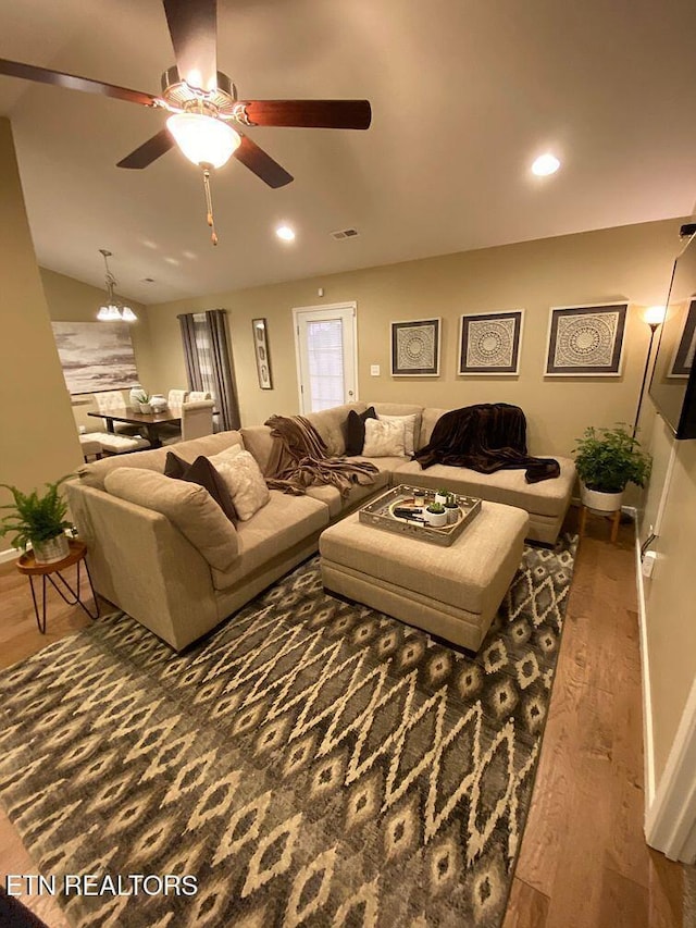 living room featuring ceiling fan, visible vents, wood finished floors, and recessed lighting