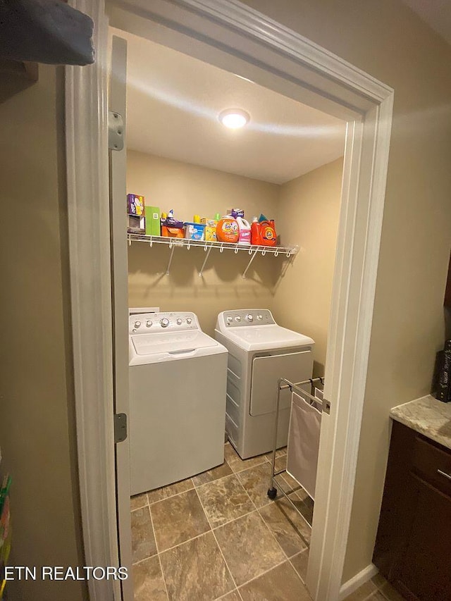 clothes washing area with laundry area and washer and clothes dryer