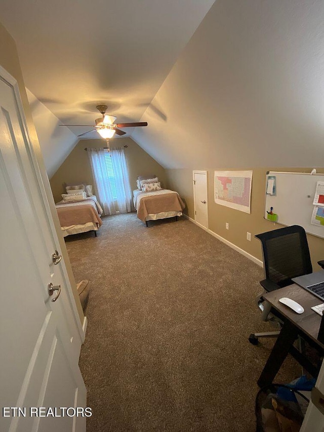 carpeted bedroom featuring baseboards, lofted ceiling, and a ceiling fan