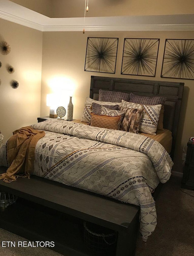 bedroom with carpet flooring and ornamental molding