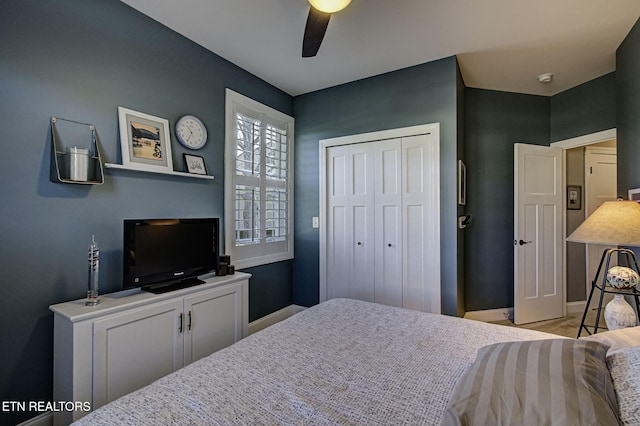 bedroom featuring a closet, a ceiling fan, and baseboards