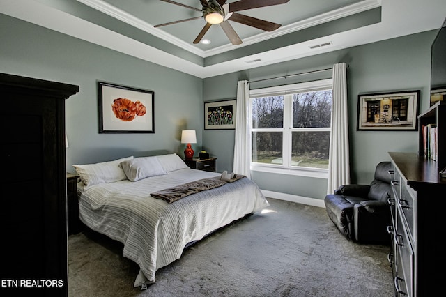 bedroom with visible vents, a raised ceiling, carpet flooring, and ornamental molding