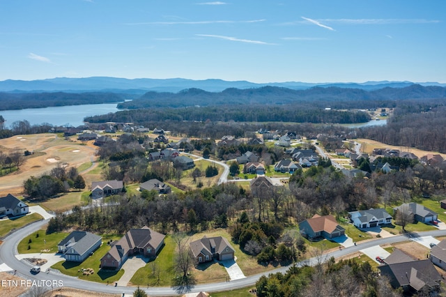 aerial view with a residential view and a water and mountain view