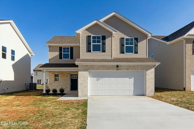 traditional-style home with a garage, concrete driveway, central AC unit, and brick siding