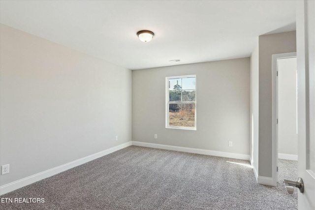 unfurnished bedroom with carpet and baseboards