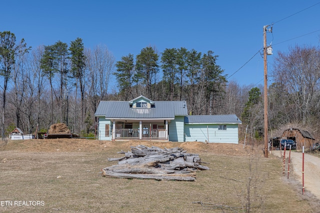 view of front of house featuring metal roof