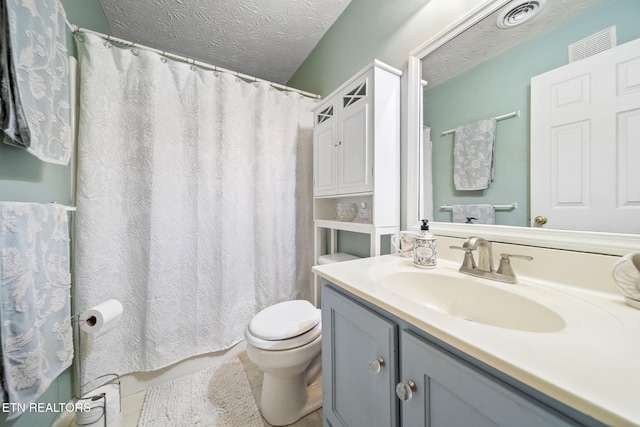 full bathroom with a textured ceiling, toilet, vanity, and visible vents