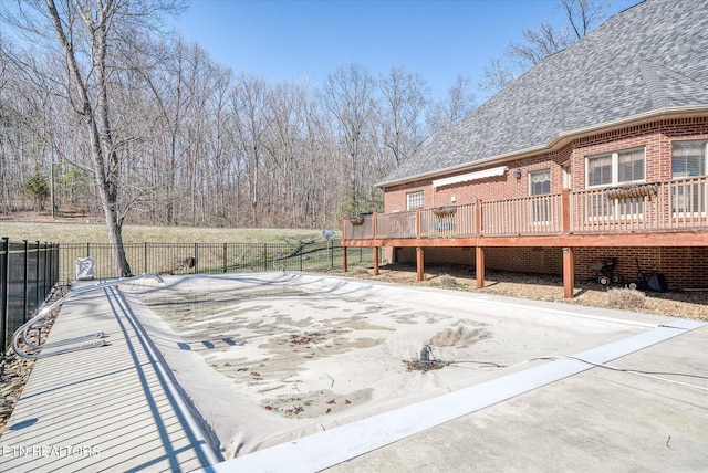 view of yard featuring fence and a wooden deck