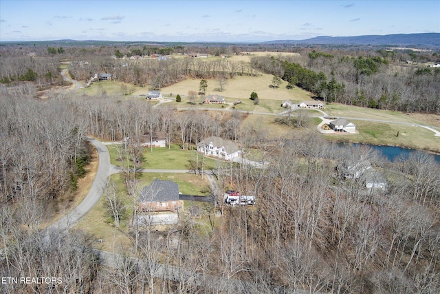 birds eye view of property with a rural view