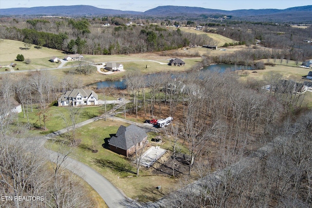 aerial view with a rural view and a water and mountain view