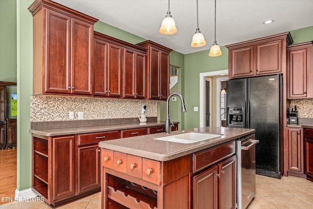 kitchen with light tile patterned floors, a sink, dishwasher, open shelves, and an island with sink