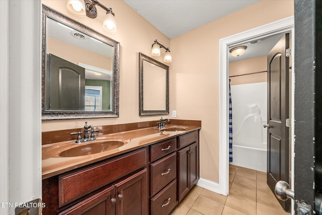 bathroom featuring tile patterned flooring, shower / bath combo, a sink, and double vanity