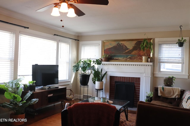 living room with a brick fireplace and crown molding