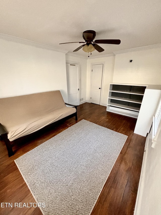 unfurnished bedroom with crown molding, ceiling fan, and wood finished floors