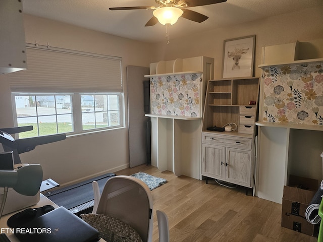 interior space featuring light wood-type flooring and ceiling fan