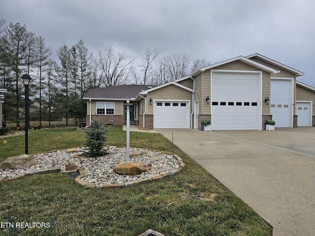 view of front of property featuring driveway, brick siding, a front lawn, and an attached garage